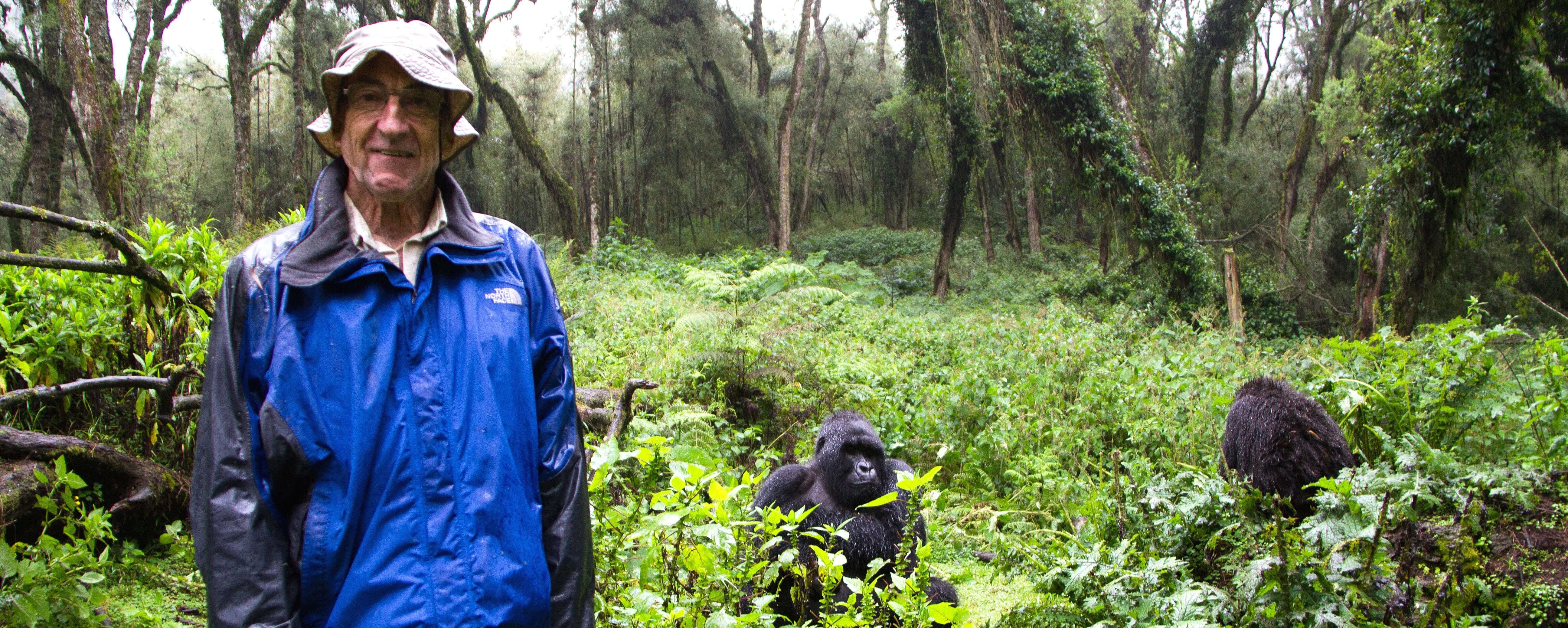 Author Neil getting soggy with primates in Rwanda