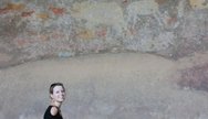 Miriam looking at the cave paintings in the Bambata Cave in the Matopos, Matobo NP, Zimbabwe