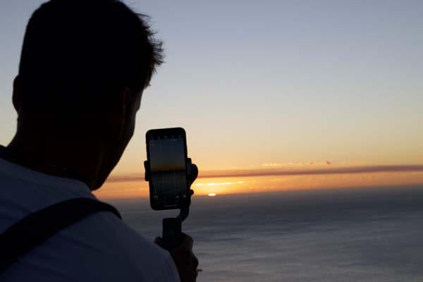 Joe Garcia capturing the sunset at Chapmans Peak Bay