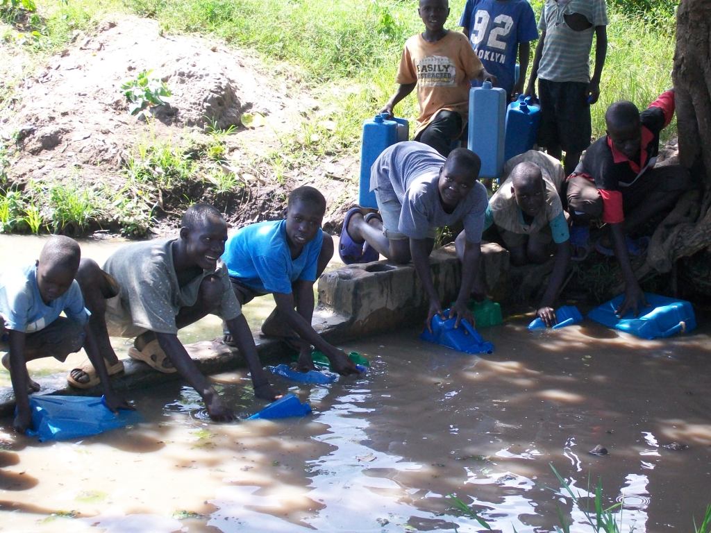 Children at a traditional water source