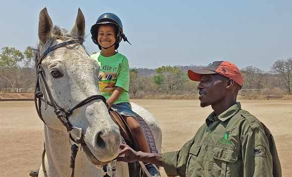 Young horseback rider, Hwange