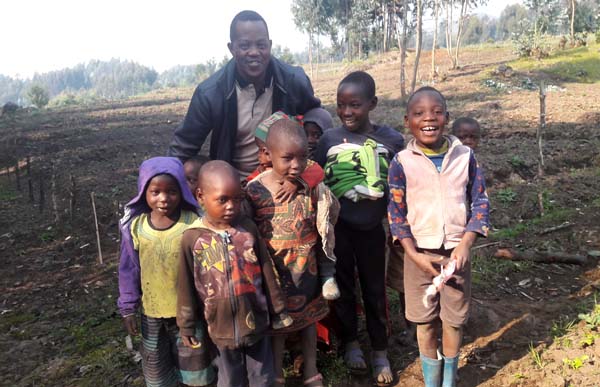 David Mugisha and children in Rwanda
